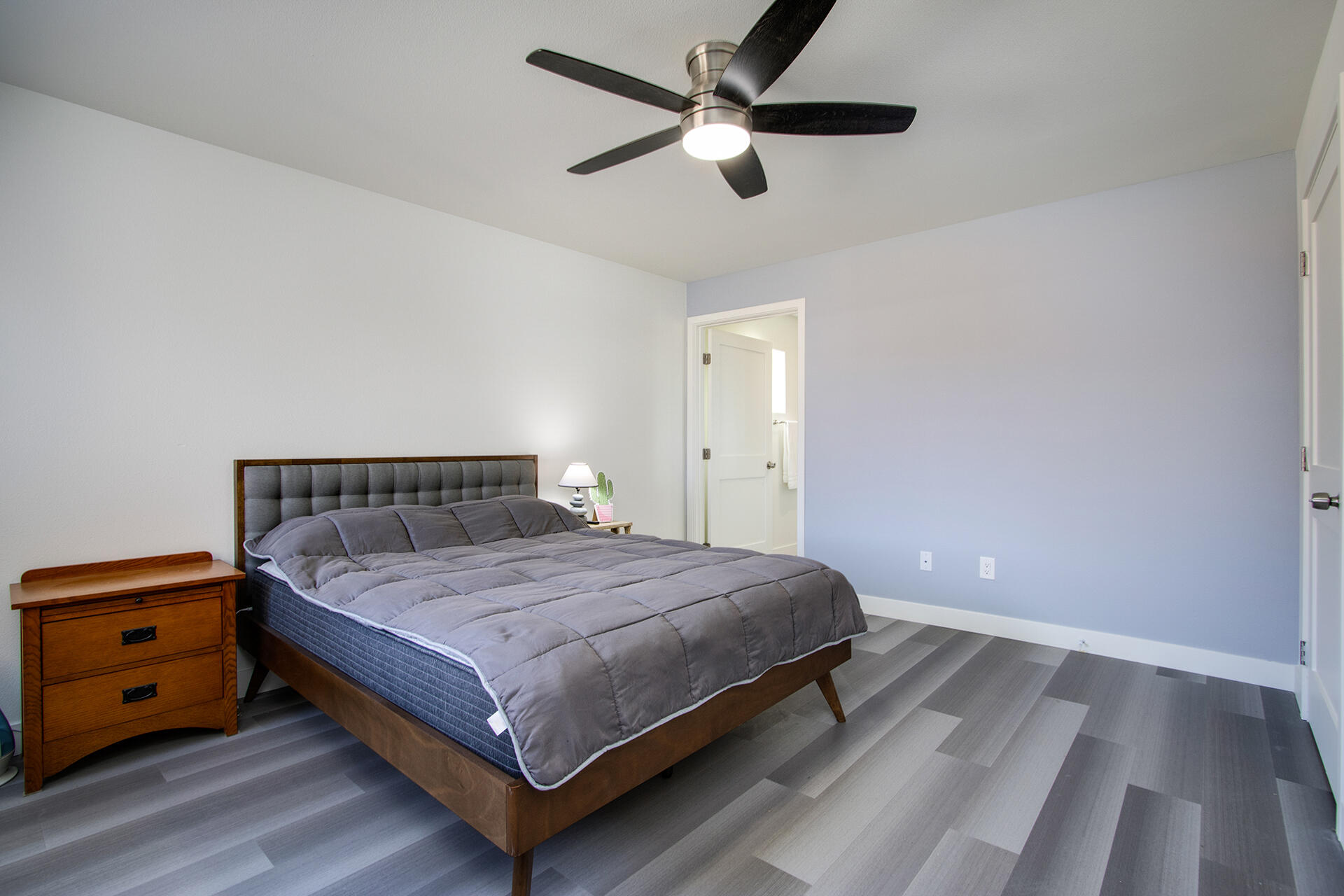 61786 Desert Air Road Joshua Tree, CA 92252 - Photo 29 of 54 a bedroom with a bed and a ceiling fan