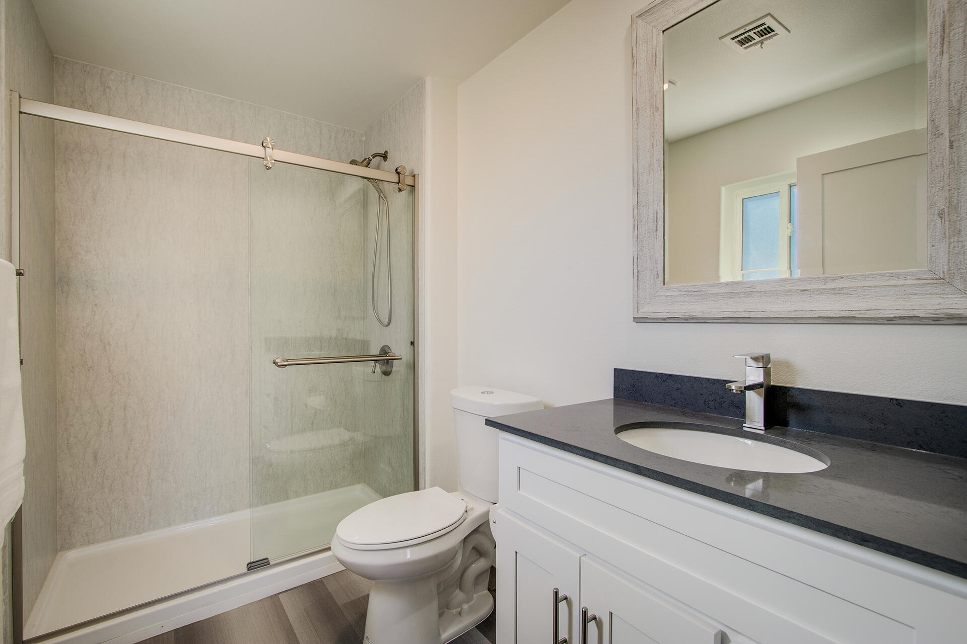 61786 Desert Air Road Joshua Tree, CA 92252 - Photo 30 of 54 a bathroom with a granite countertop sink toilet and shower