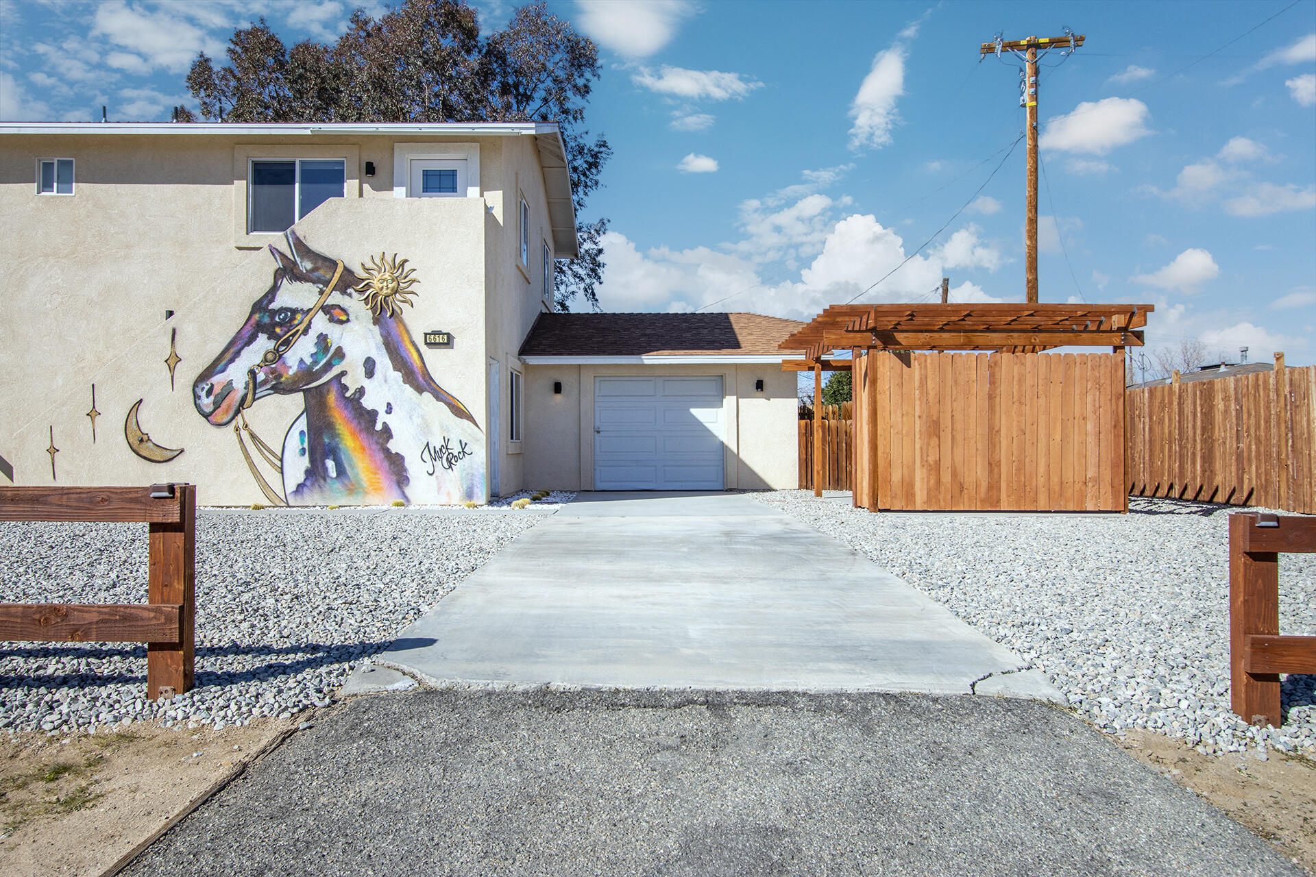 61786 Desert Air Road Joshua Tree, CA 92252 - Photo 3 of 54 a view of a house with a patio