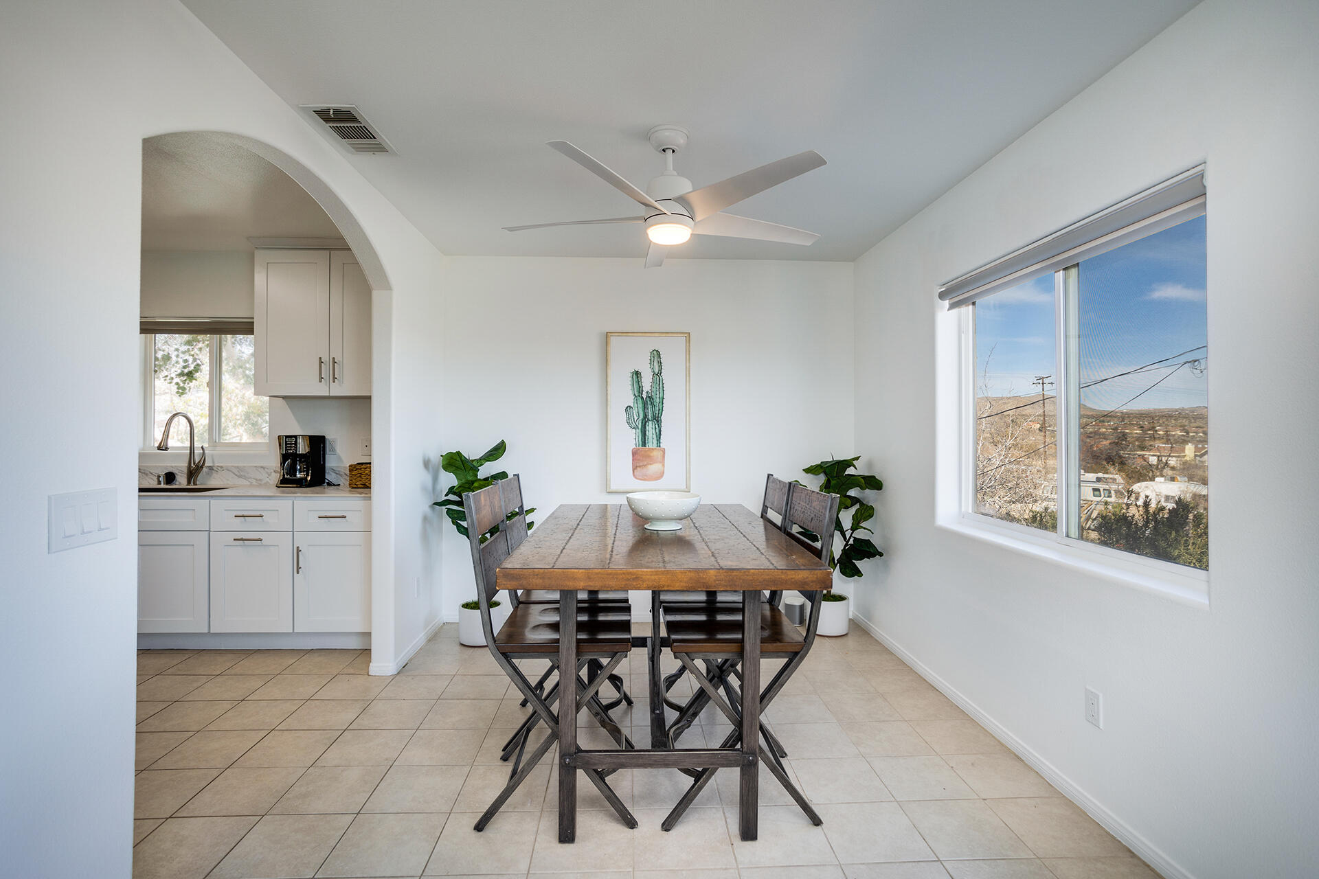 61786 Desert Air Road Joshua Tree, CA 92252 - Photo 37 of 54 a dining room with furniture and window