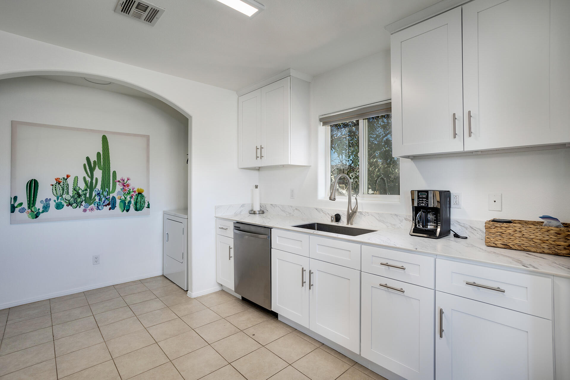 61786 Desert Air Road Joshua Tree, CA 92252 - Photo 38 of 54 a kitchen with white cabinets and sink