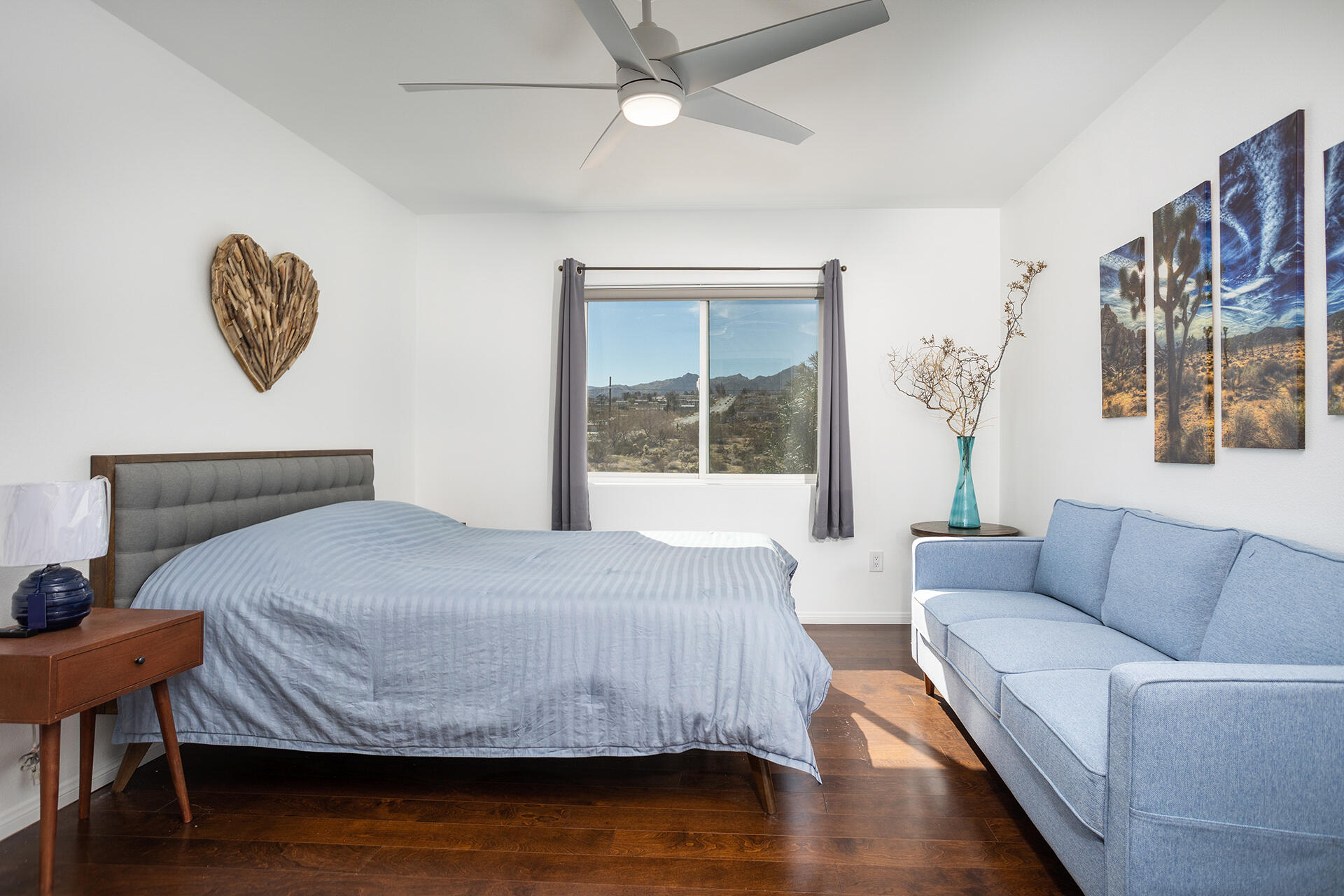 61786 Desert Air Road Joshua Tree, CA 92252 - Photo 44 of 54 a bedroom with a bed and wooden floor