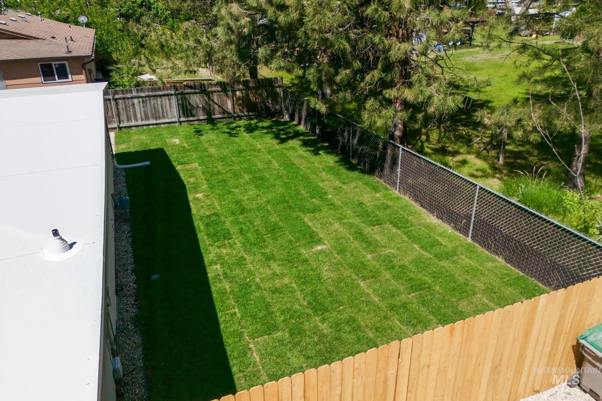 2224 Rachel Circle Boise, ID 83706 - Photo 50 of 50 Expansive rectangular lawn bordered by a wood privacy fence and chain link fencing