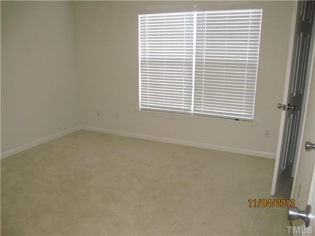 5108 Sansome Trail Raleigh, NC 27610 - Photo 9 of 11 an empty room with a window