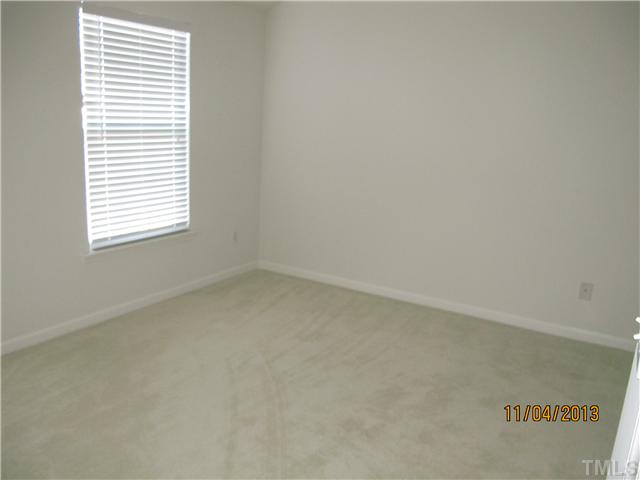 5108 Sansome Trail Raleigh, NC 27610 - Photo 10 of 11 an empty room with a window