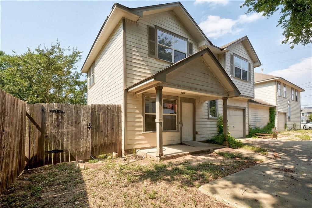 1171 Webberville Road Austin, TX 78721 - Photo 1 of 1 a view of a house with a small backyard