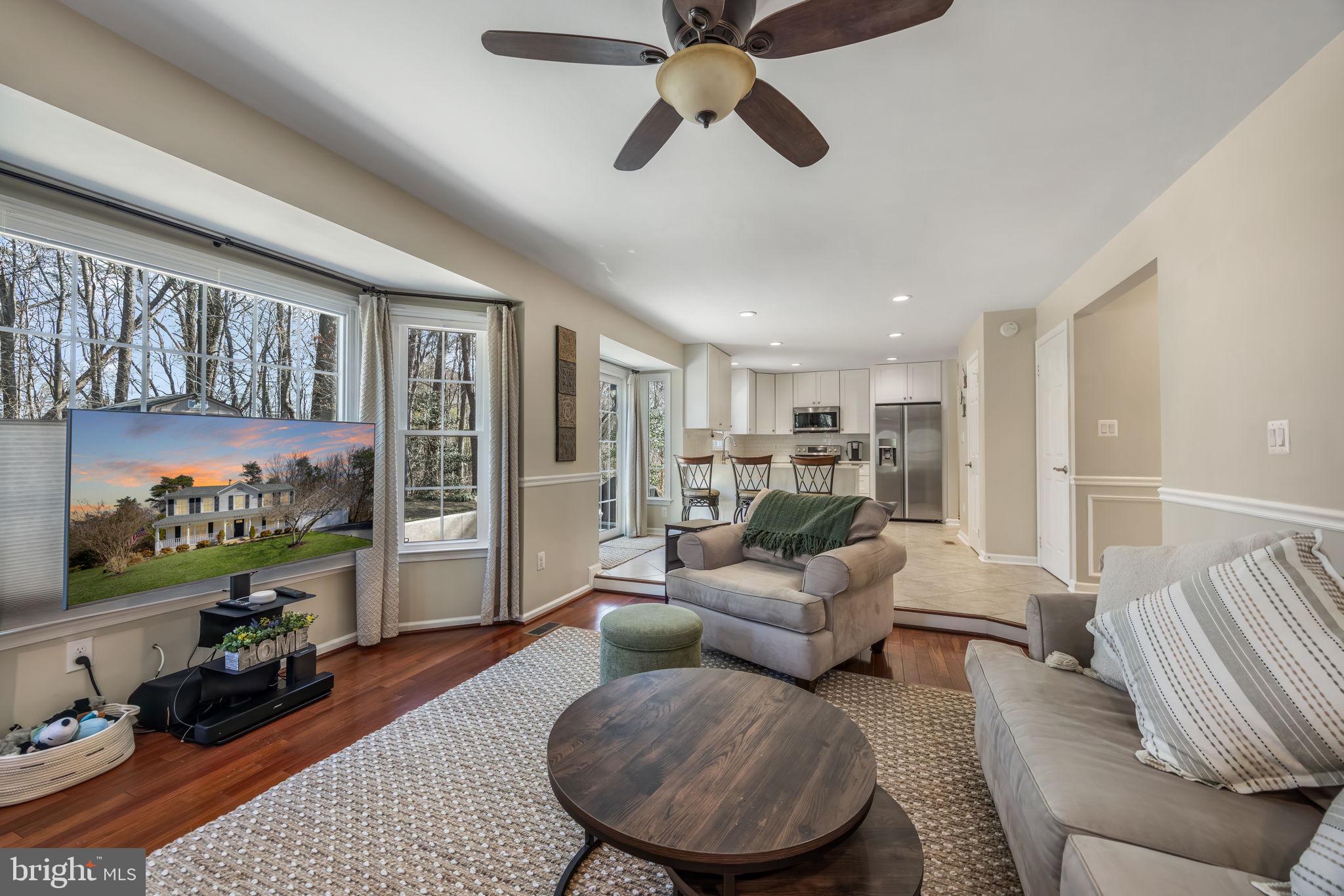 8504 Silverdale Road Lorton, VA 22079 - Photo 16 of 48 a living room with furniture and a flat screen tv