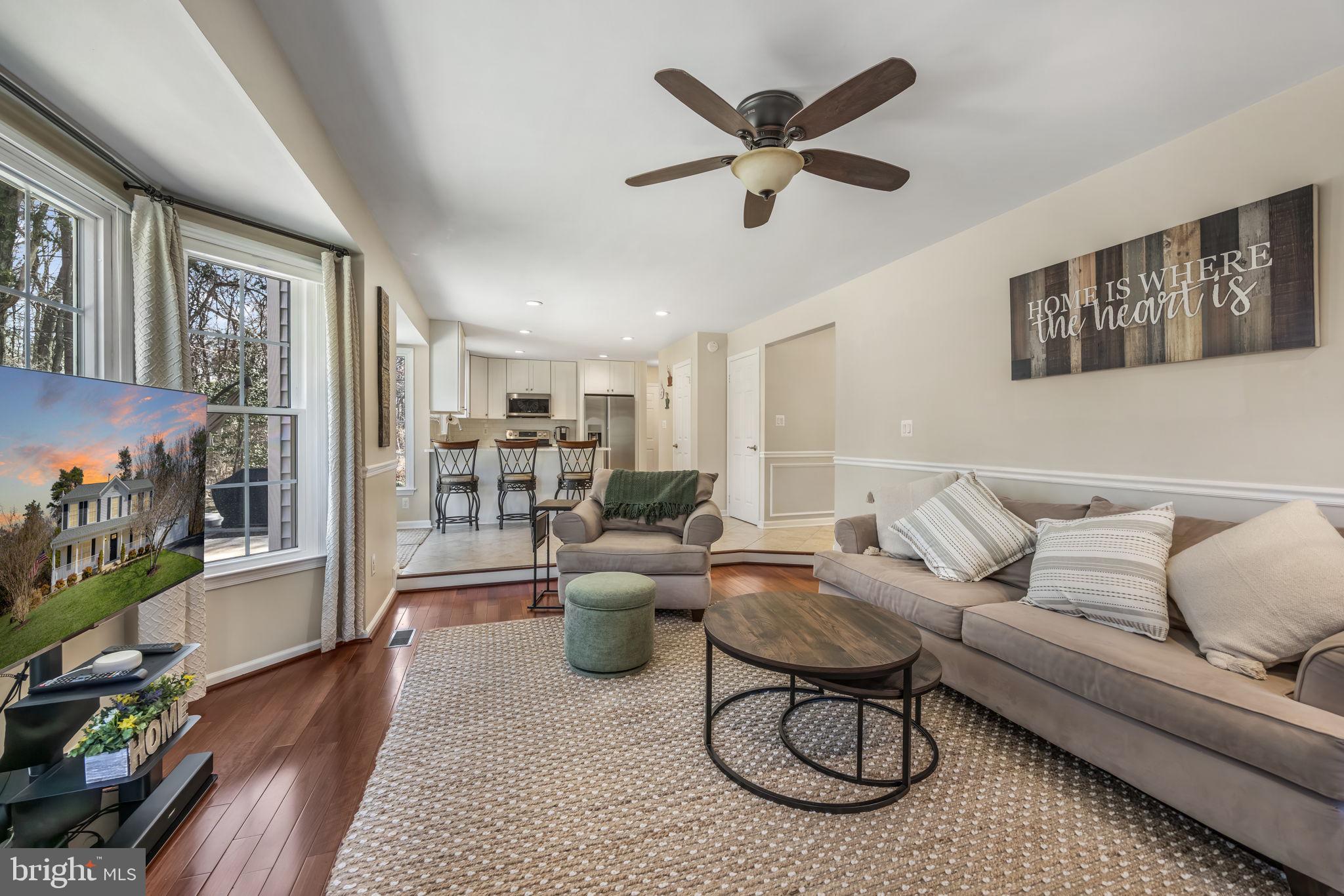 8504 Silverdale Road Lorton, VA 22079 - Photo 17 of 48 a living room with furniture a rug and a window