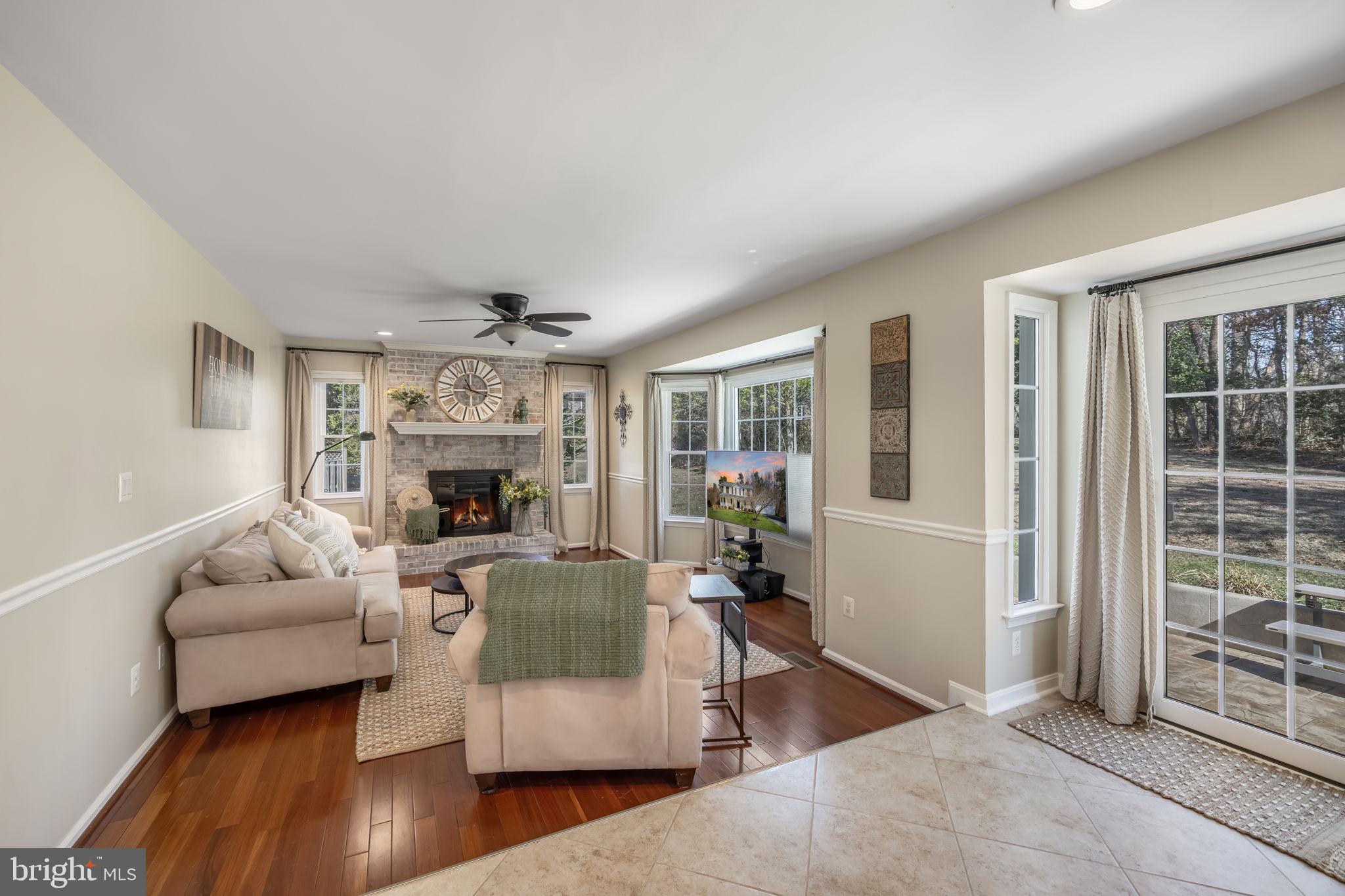 8504 Silverdale Road Lorton, VA 22079 - Photo 20 of 48 a living room with furniture and a fireplace