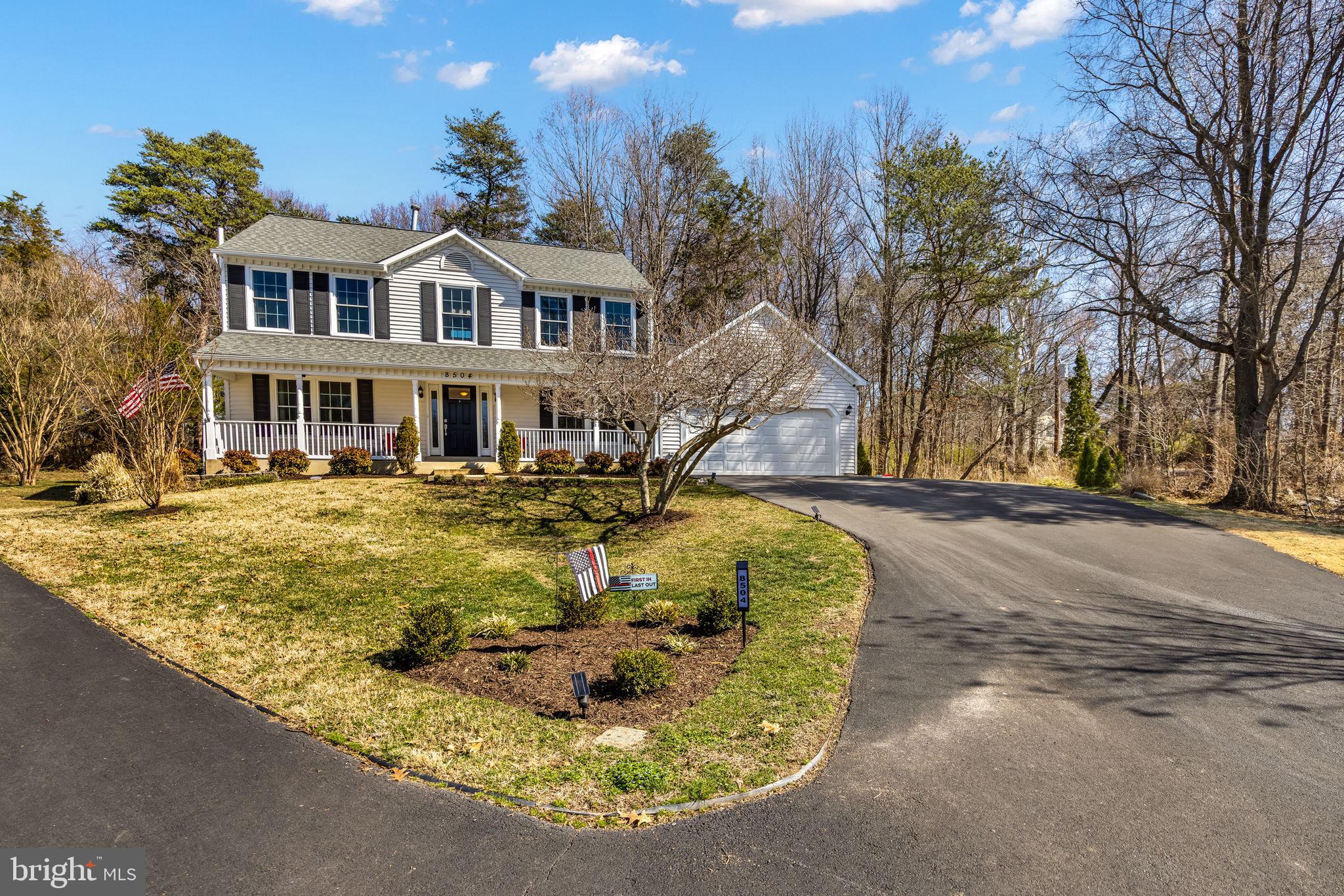 8504 Silverdale Road Lorton, VA 22079 - Photo 2 of 48 a view of a house with snow on the road