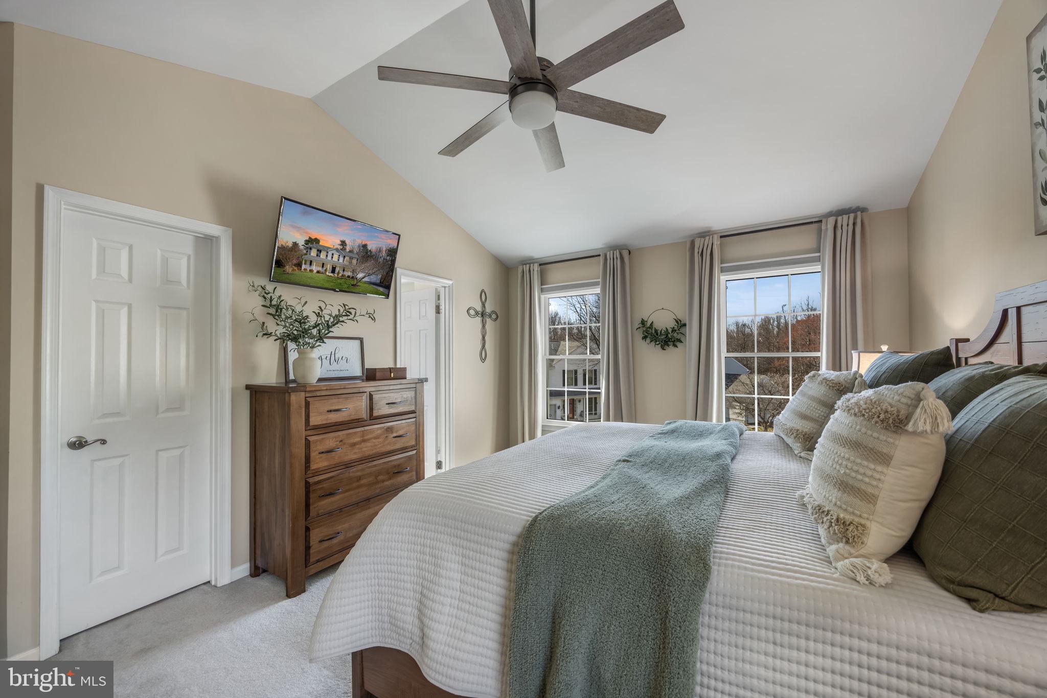 8504 Silverdale Road Lorton, VA 22079 - Photo 23 of 48 a bedroom with a large bed and a window