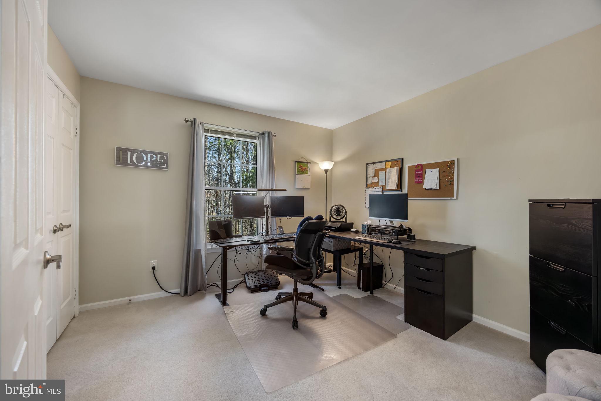 8504 Silverdale Road Lorton, VA 22079 - Photo 28 of 48 a view of a workspace with furniture and a window