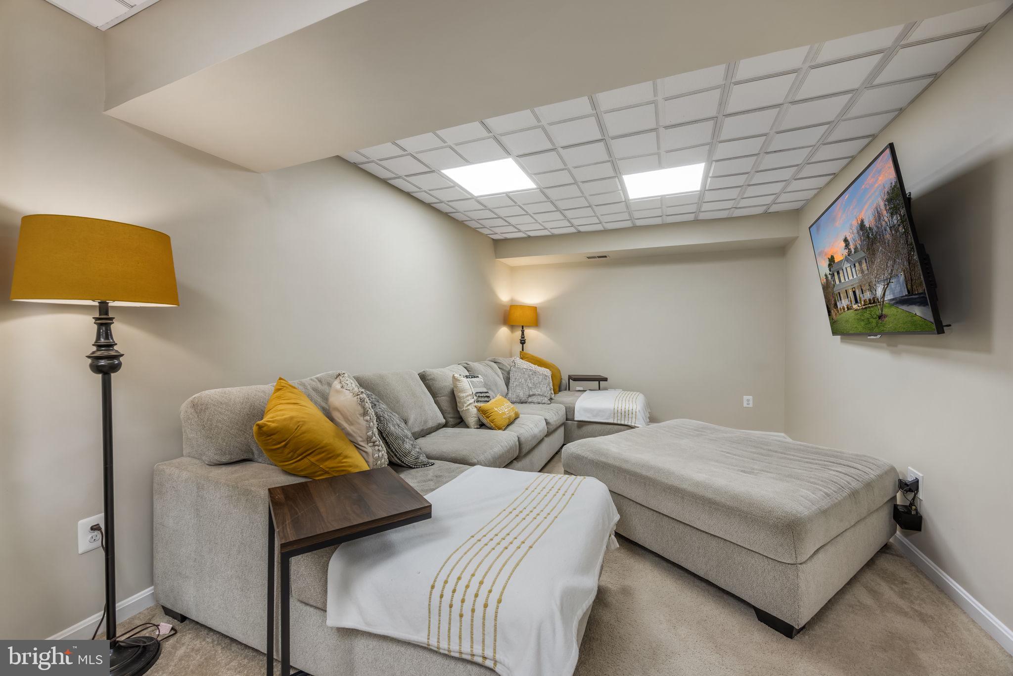 8504 Silverdale Road Lorton, VA 22079 - Photo 37 of 48 a bedroom with two beds and a flat screen tv