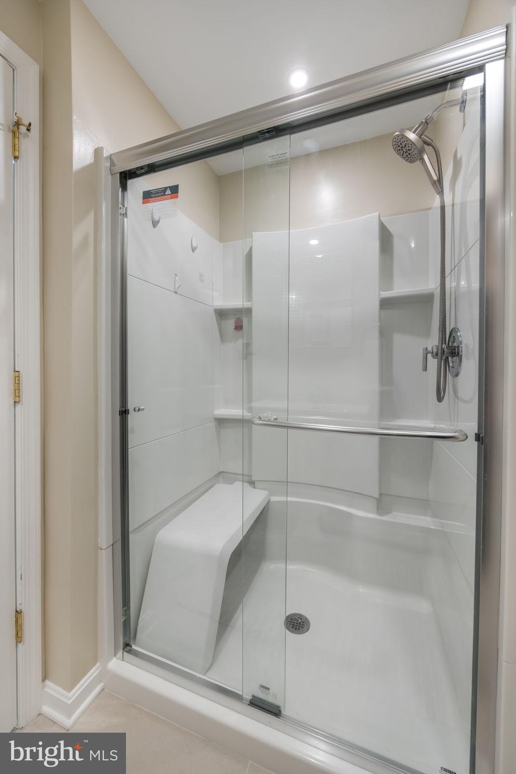 8504 Silverdale Road Lorton, VA 22079 - Photo 38 of 48 a bathroom with a bathtub and a shower