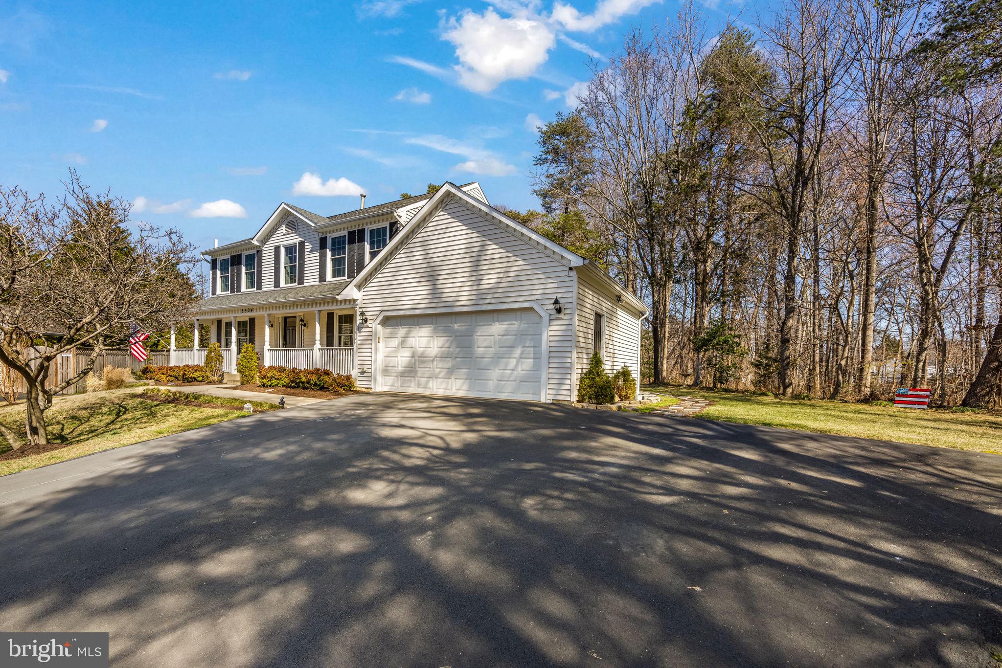 8504 Silverdale Road Lorton, VA 22079 - Photo 4 of 48 a view of a house with a yard and large trees