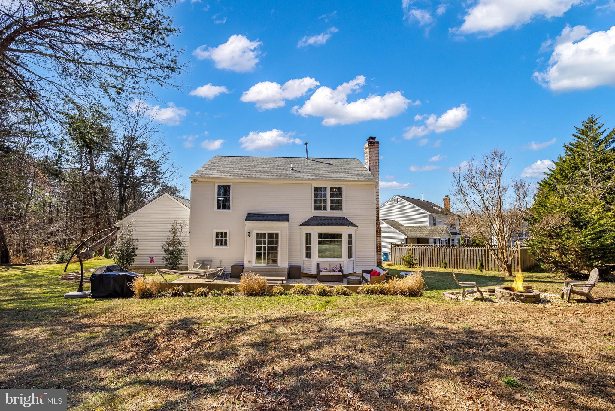 8504 Silverdale Road Lorton, VA 22079 - Photo 41 of 48 a view of a white house with a yard covered with snow