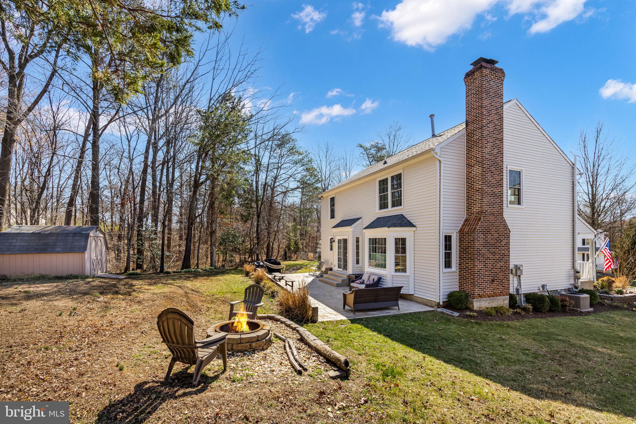 8504 Silverdale Road Lorton, VA 22079 - Photo 44 of 48 a view of a house with backyard and sitting area