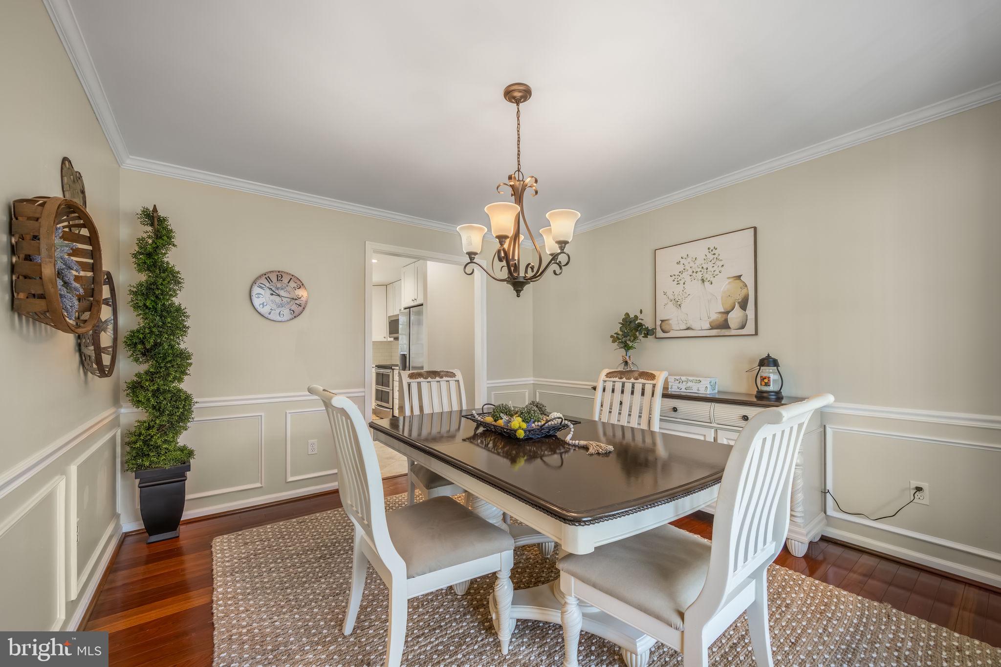 8504 Silverdale Road Lorton, VA 22079 - Photo 8 of 48 a view of a dining room with furniture and chandelier