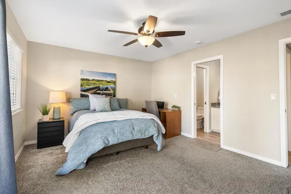 a bedroom with a bed and window