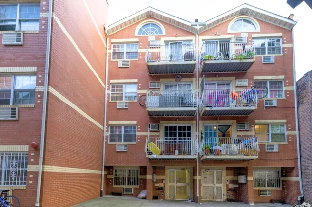 a front view of a large building with a lot of windows