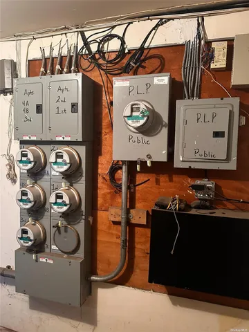 a utility room with multiple dryer and washer