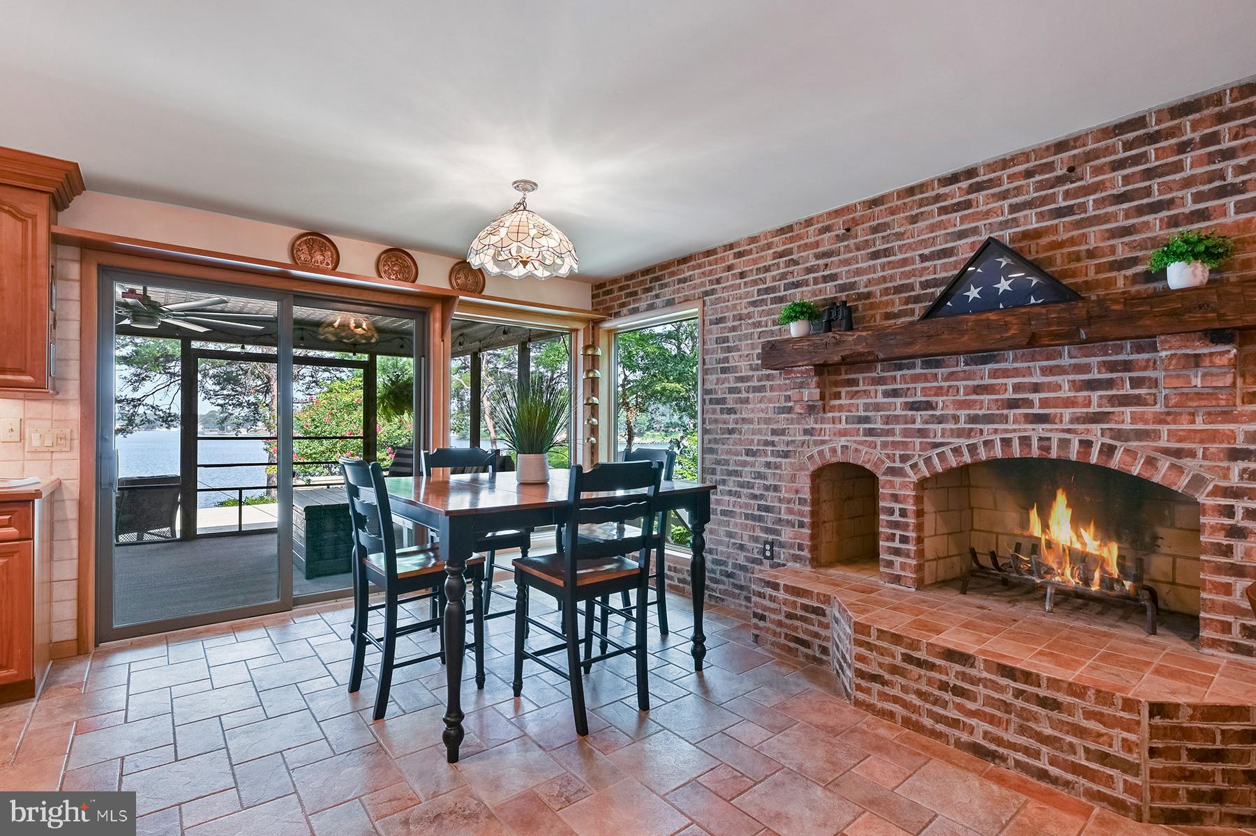 344 Hunner Road Pasadena, MD 21122 - Photo 12 of 55 Informal dining and wood-burning fireplace