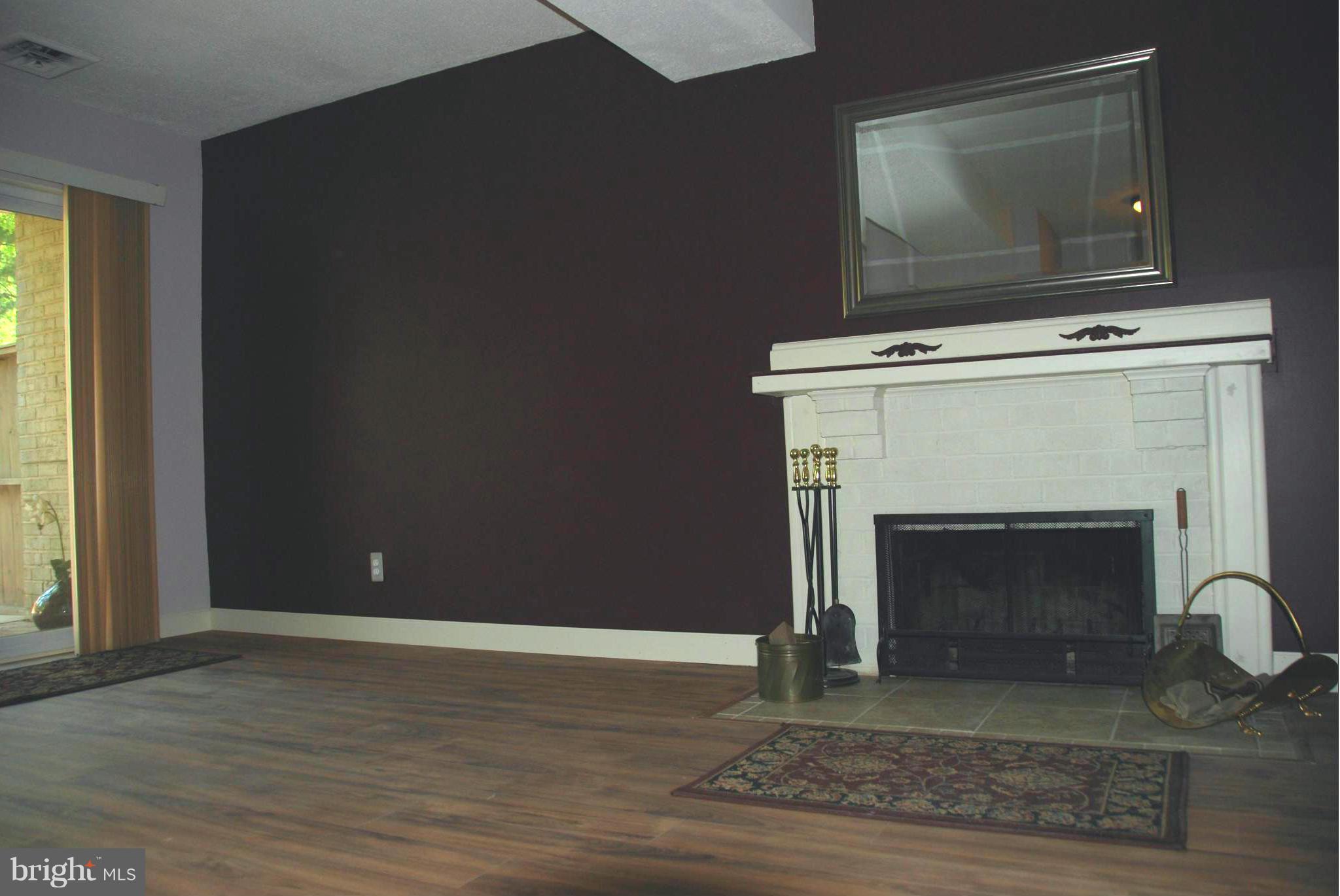 11019 Saffold Way Reston, VA 20190 - Photo 19 of 22 a living room with a fireplace
