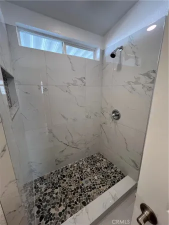 a bathroom with a toilet a sink a mirror and vanity