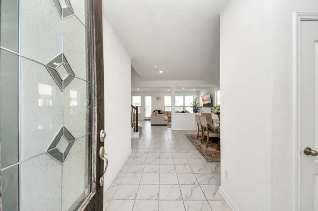 a view of a living room with a fireplace