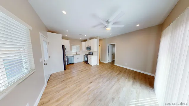 a kitchen with a sink stove and refrigerator