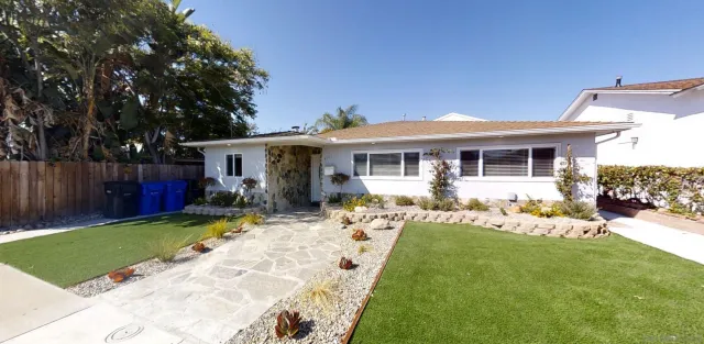 a front view of a house with a yard patio
