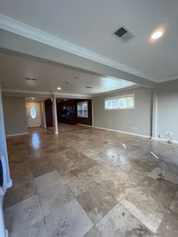 a view of a room with window and stairs