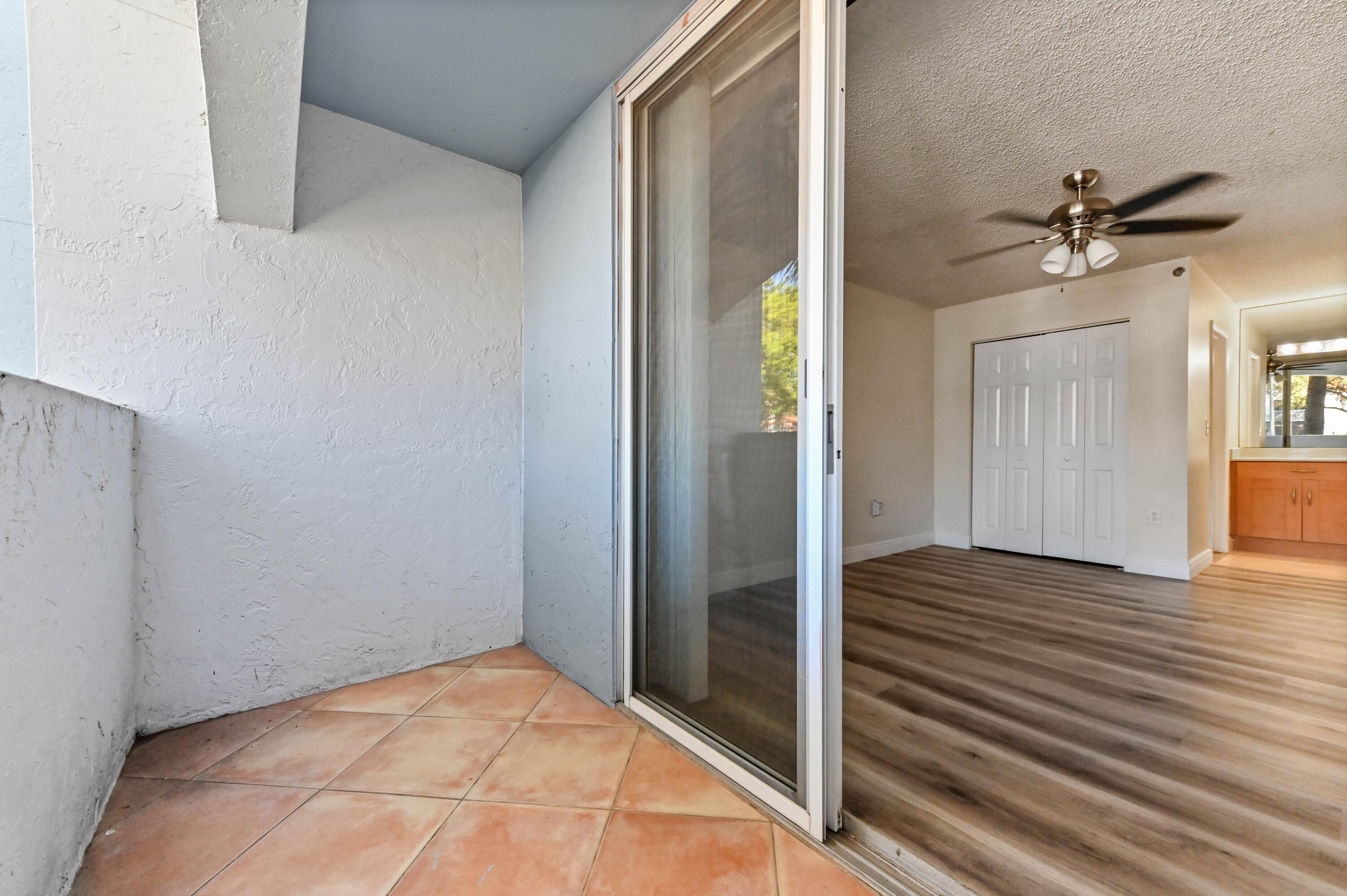 3237 Clint Moore Road, Unit 107 Boca Raton, FL 33496 - Photo 18 of 41 a view of a hallway with wooden floor