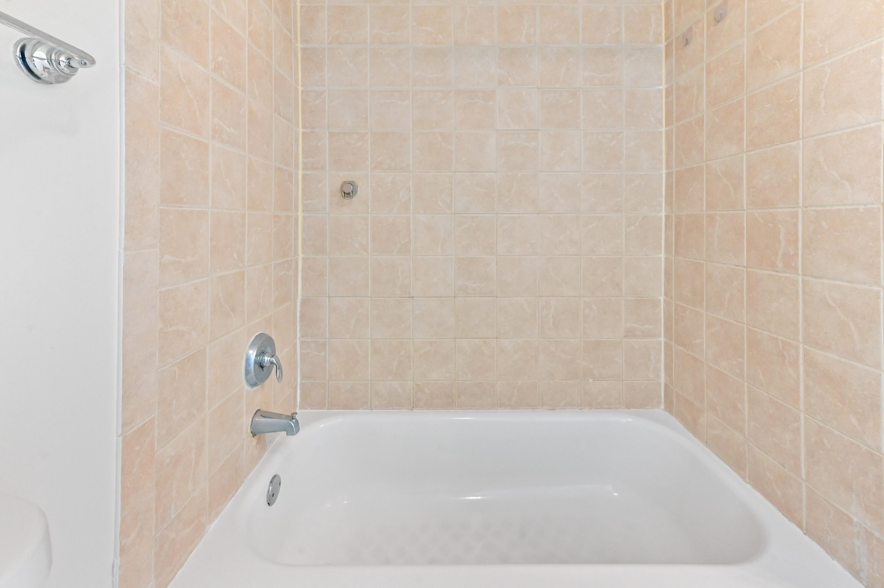 3237 Clint Moore Road, Unit 107 Boca Raton, FL 33496 - Photo 23 of 41 a bathroom with a bathtub