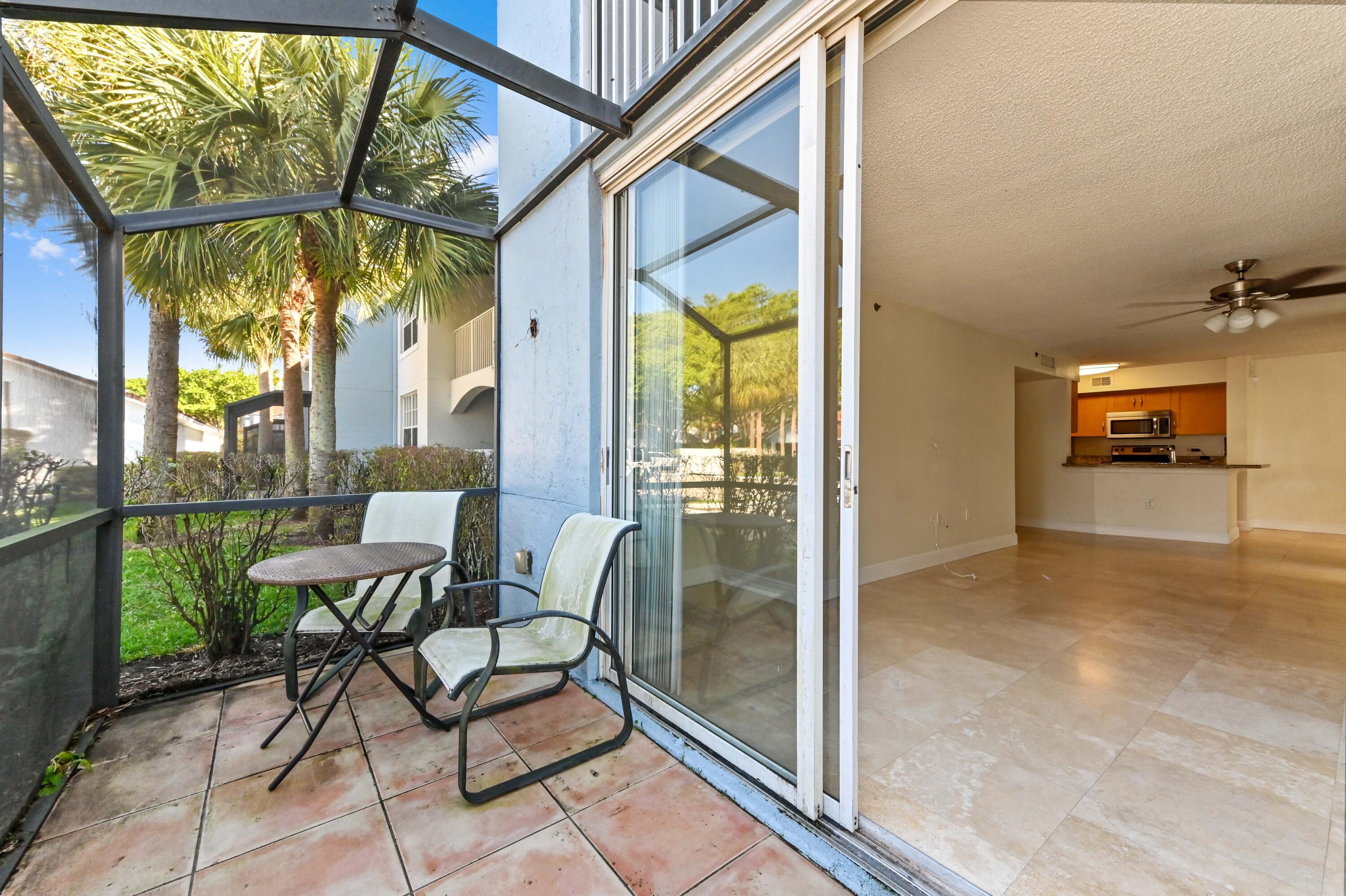 3237 Clint Moore Road, Unit 107 Boca Raton, FL 33496 - Photo 25 of 41 a view of an outdoor space with seating area