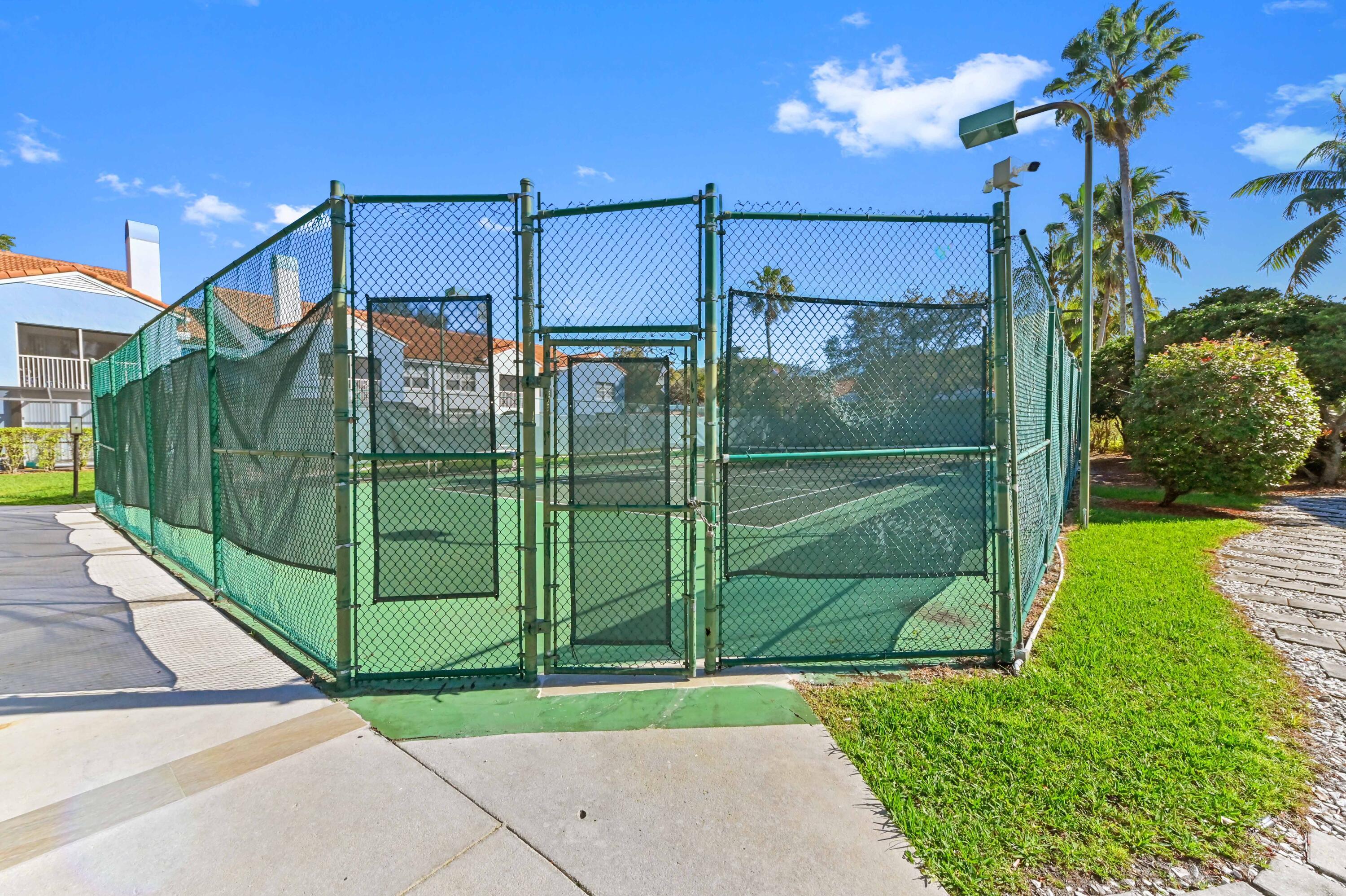 3237 Clint Moore Road, Unit 107 Boca Raton, FL 33496 - Photo 40 of 41 a view of a street in front of a house