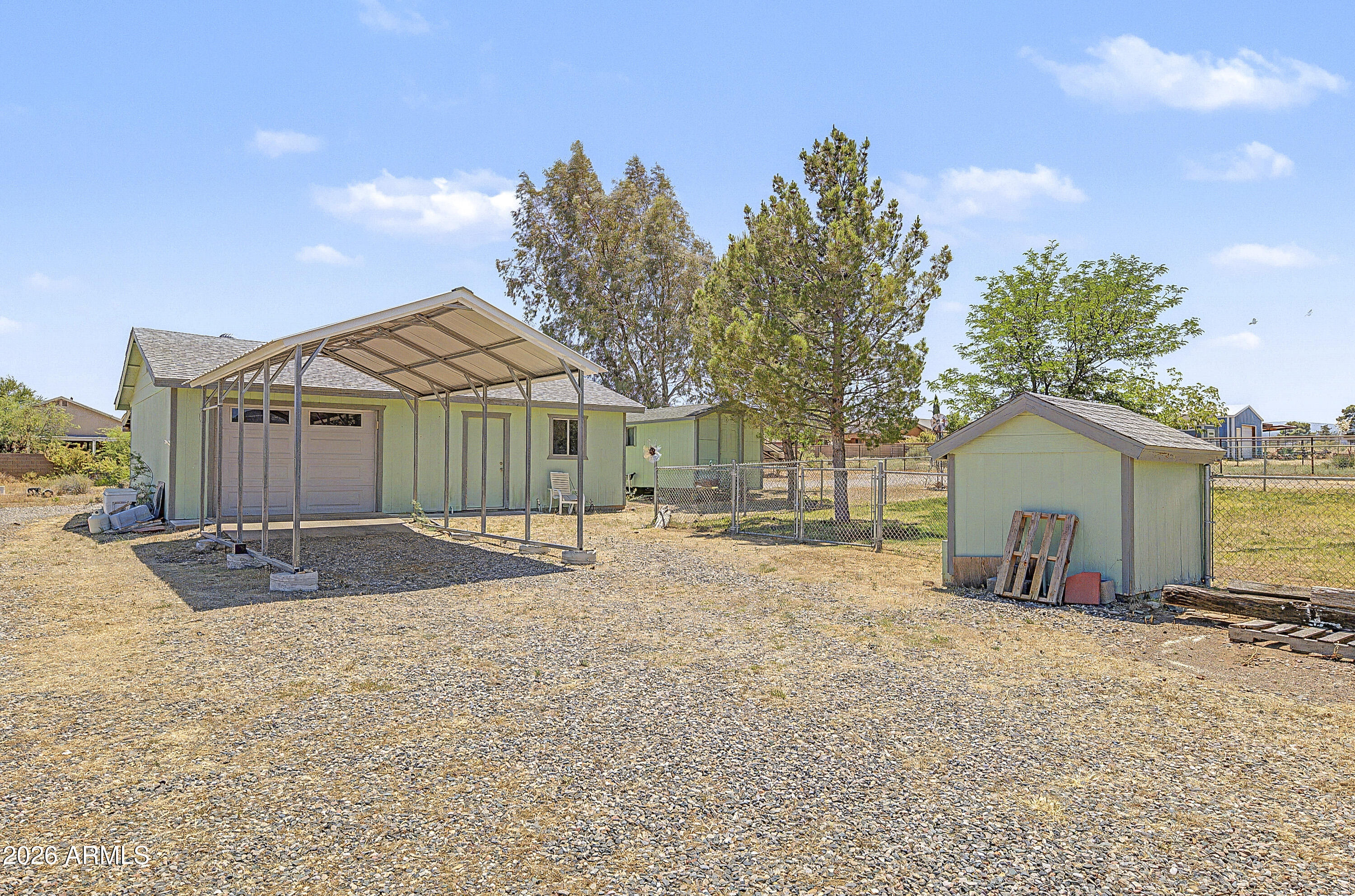 633 Oasis Road Camp Verde, AZ 86322 - Photo 6 of 50 a view of a house with a yard and garage