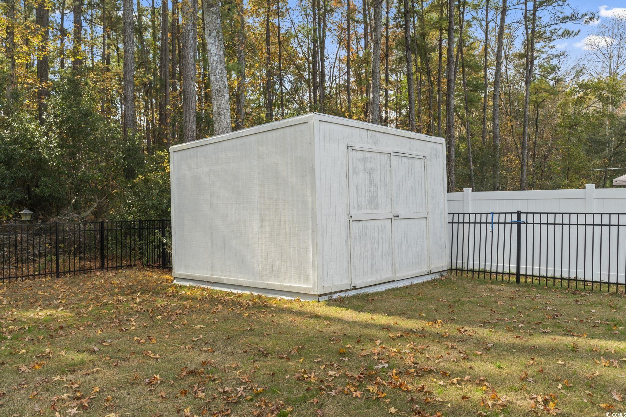 2715 Biscane Court Conway, SC 29527 - Photo 18 of 18 View of shed with a fenced backyard