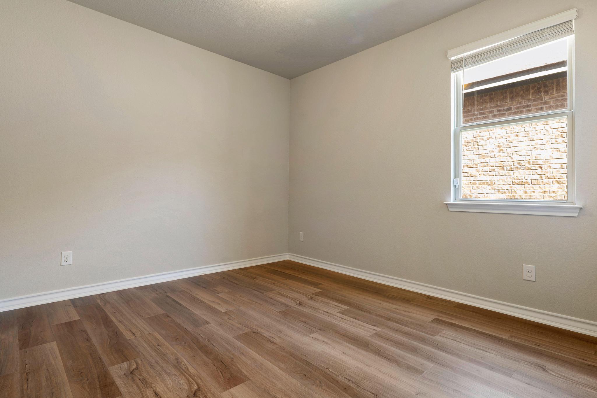 1341 Eagle Ray Street Leander, TX 78641 - Photo 20 of 37 Natural light illuminates this versatile room with durable wood flooring and ample space.