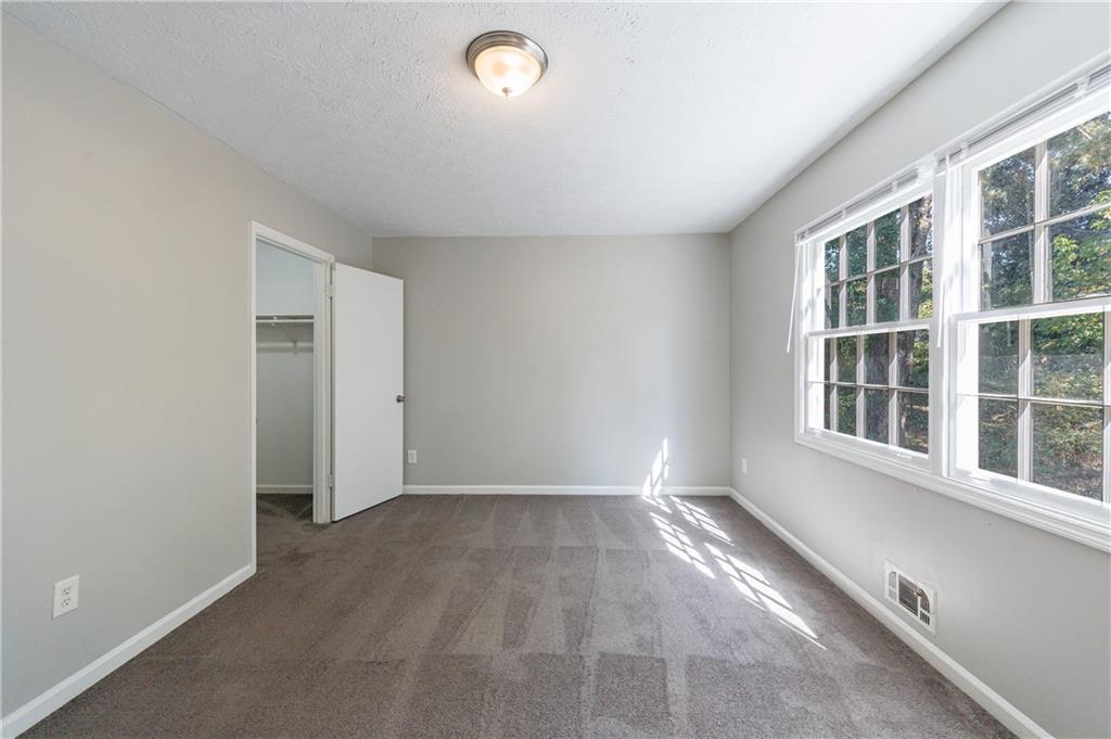 5755 Bearing Way Atlanta, GA 30349 - Photo 13 of 31 an empty room with windows