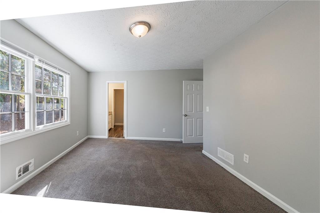 5755 Bearing Way Atlanta, GA 30349 - Photo 14 of 31 an empty room with windows