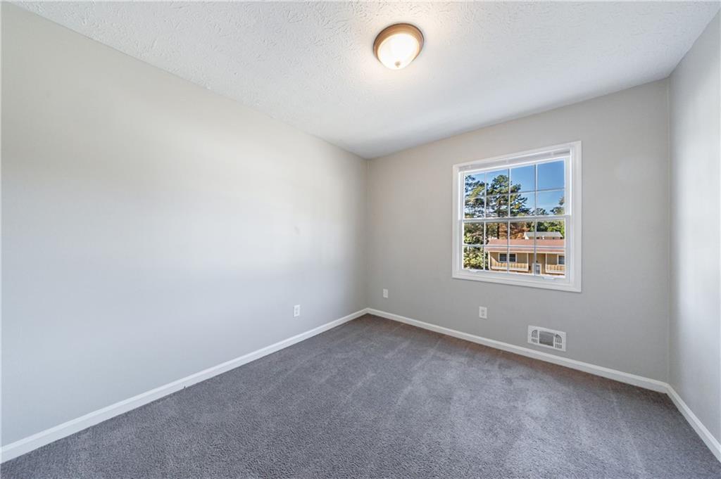 5755 Bearing Way Atlanta, GA 30349 - Photo 15 of 31 an empty room with a window