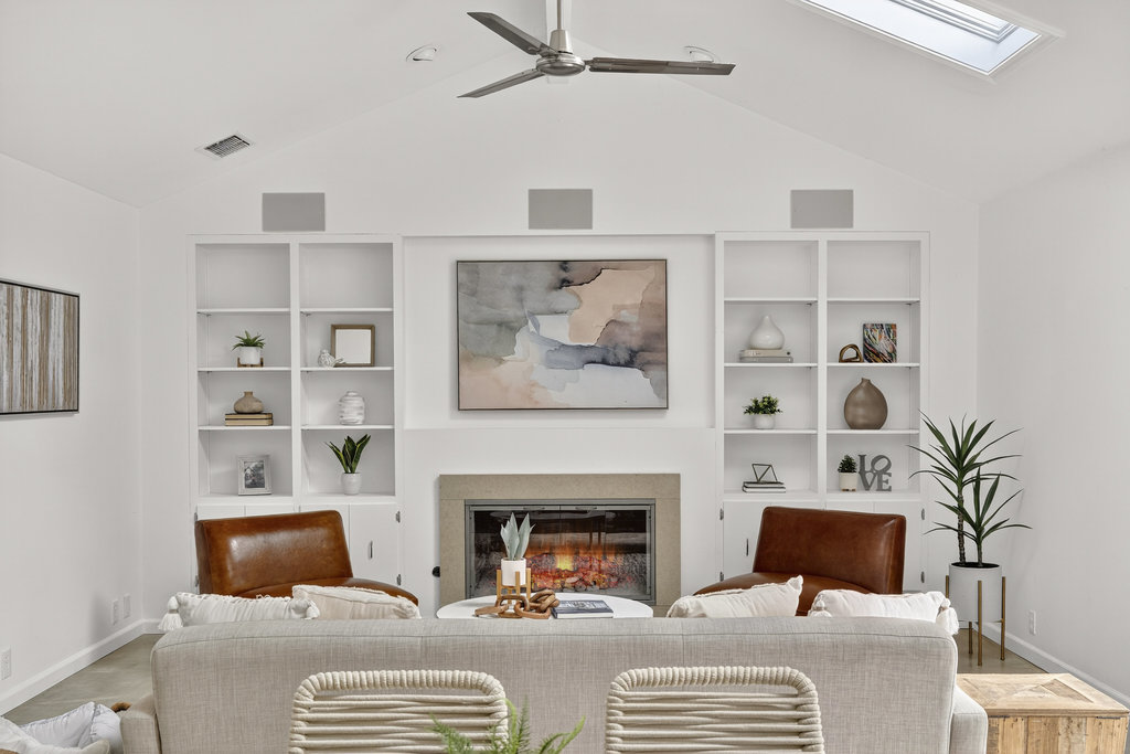 2202 Cypress Point East Austin, TX 78746 - Photo 11 of 36 Built-ins frame the cozy gas fireplace.