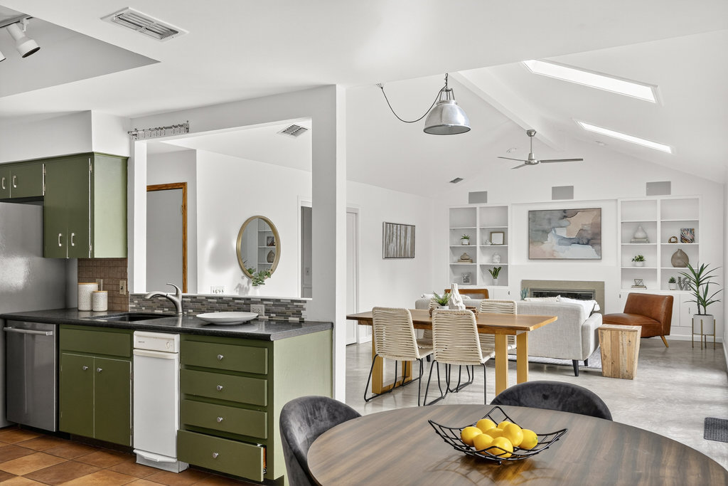 2202 Cypress Point East Austin, TX 78746 - Photo 19 of 36 Two dining spaces surround the kitchen for a seamless serving experience.