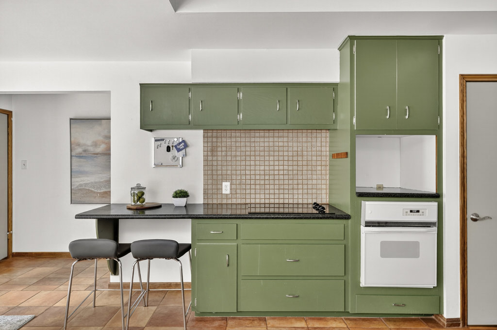 2202 Cypress Point East Austin, TX 78746 - Photo 21 of 36 Granite counters adorn the kitchen.