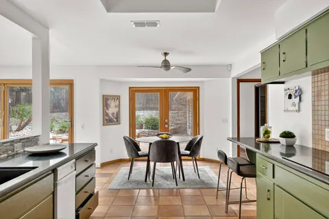 a view of a dining room with furniture window and outside view