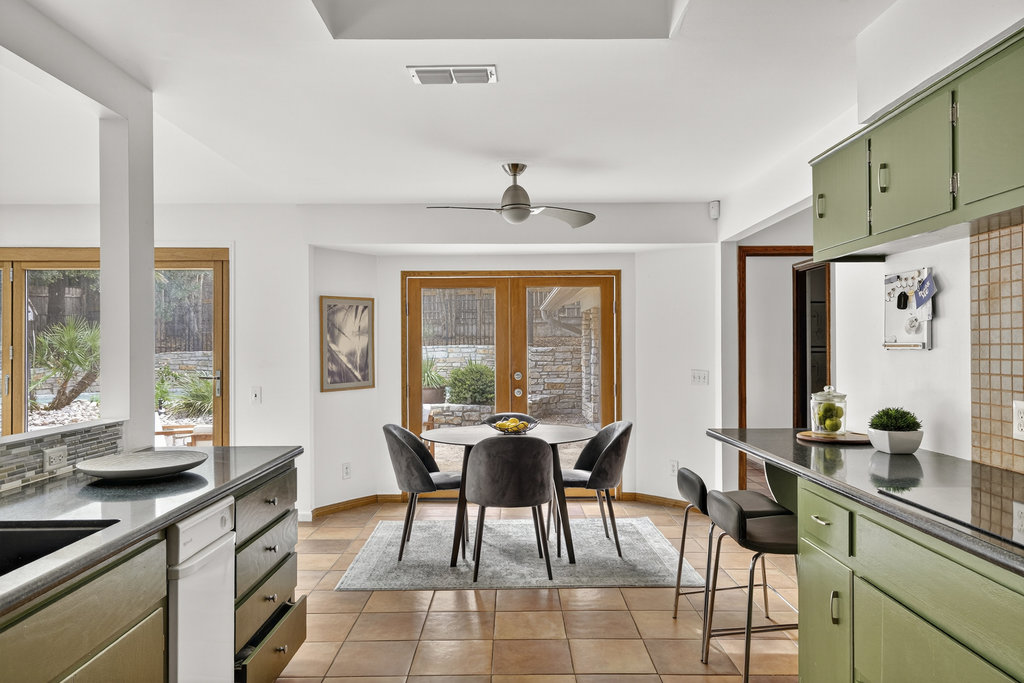 2202 Cypress Point East Austin, TX 78746 - Photo 25 of 36 Enjoy the peaceful backyard view from the kitchen and dining areas.