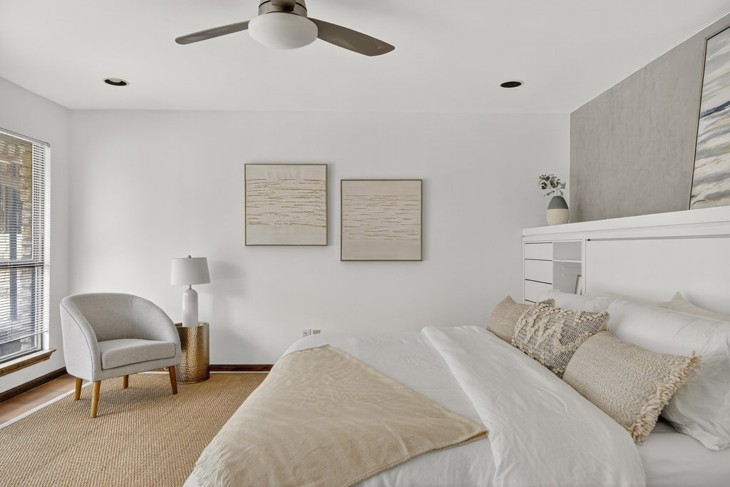 2202 Cypress Point East Austin, TX 78746 - Photo 28 of 36 The bedroom overlooks the backyard with French door access to the patio.