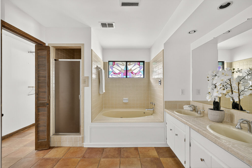 2202 Cypress Point East Austin, TX 78746 - Photo 29 of 36 The primary suite is complete with an ensuite bathroom.