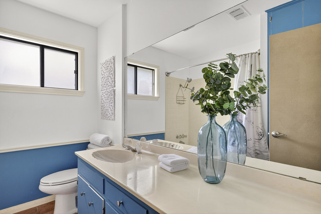 2202 Cypress Point East Austin, TX 78746 - Photo 33 of 36 The second full bath is well-appointed for the secondary bedrooms.